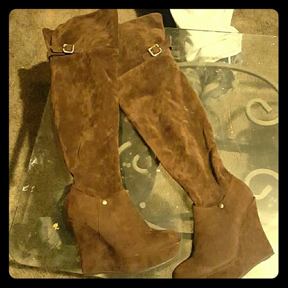Knee high brown heeled boots
