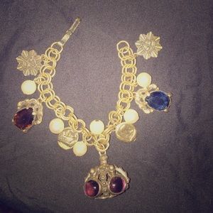 Vintage bangle bracelet with Charms hanging on it