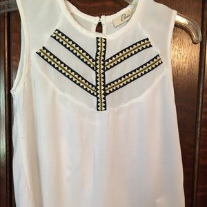 Elodie white sleeveless shirt.
