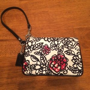Tiny coach wristlet