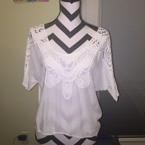 Beautiful white lace blouse.