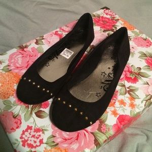 Brash black faux suede flats with gold studs