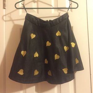 Black leather skater skirt with gold hearts
