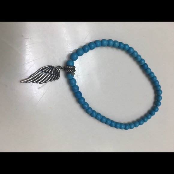 Blue bracelet with wing
