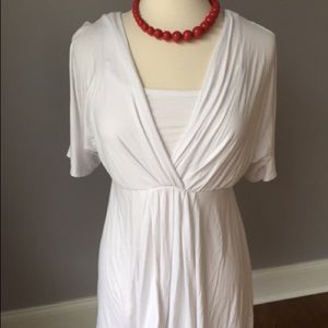 Maternity and nursing top with cut out sleeves.