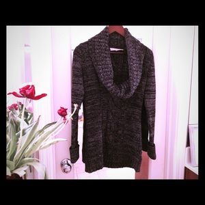 Cowl neck, mid-thigh, black/white marled sweater.