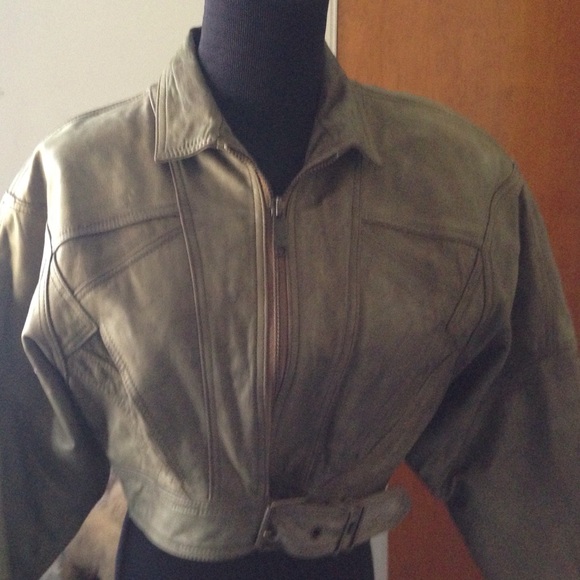 Green leather cropped jacket.