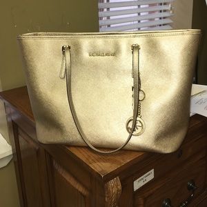 SOLD Micheal Kors gold purse