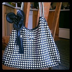 Prada bag with flower tassle