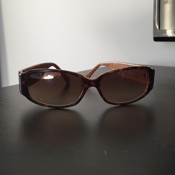 Coach sunglasses and case.