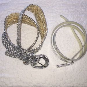 Two metallic silver belts