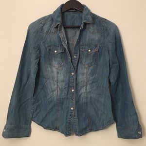 Denim shirt with pearl snap closure buttons
