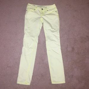 Soft yellow skinny jeans.