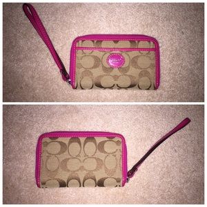 Coach wristlet with pink leather accents