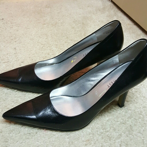 Black leather pumps