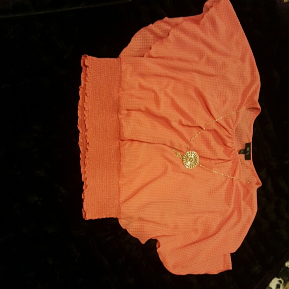 Peach business attire shirt with necklace