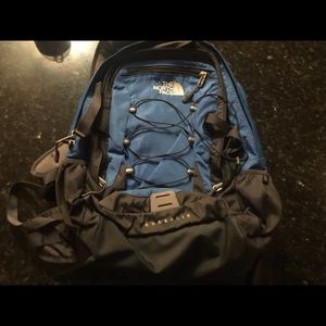Blue and black north face backpack
