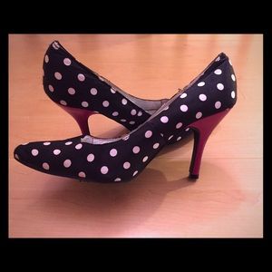 Black and white polka dot shoes with red heel