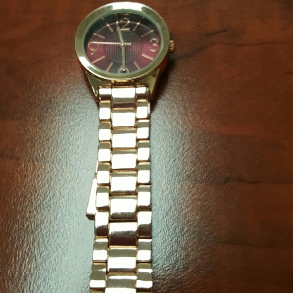 Rode gold watch with maroon face & bow bracelet
