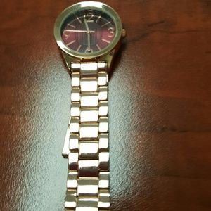 Rode gold watch with maroon face & bow bracelet