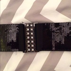 Three separate black belts with accents