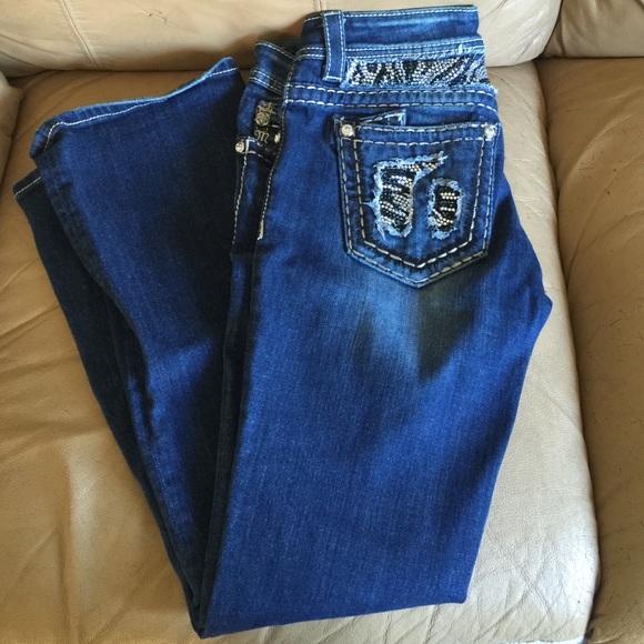 Medium wash boot cut miss me jeans