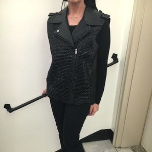 Black faux leather vest.