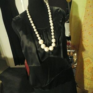 Stand out from the crowd in a pretty black blouse!