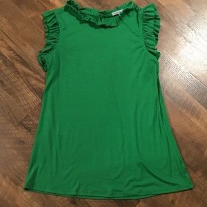 Green tank top with ruffle sleeves and neckline.