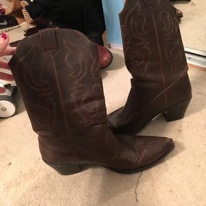 Brown cowboy boots with gold stitching