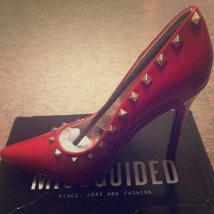Red pointed toe studded heels