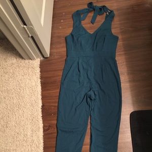 Almost new jumpsuit worn it one time. Price firm