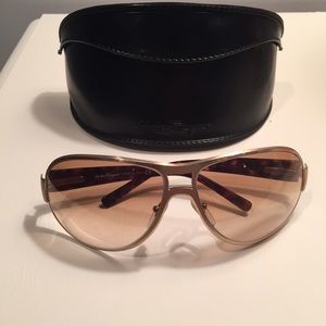 Authentic Ferragamo gold sunglasses with case.
