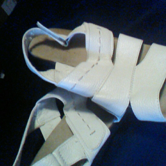 White summer sandals with a Velcro  straps on back
