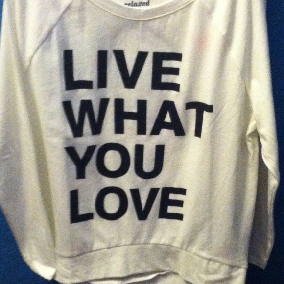 A white shirt that says Live What You Love