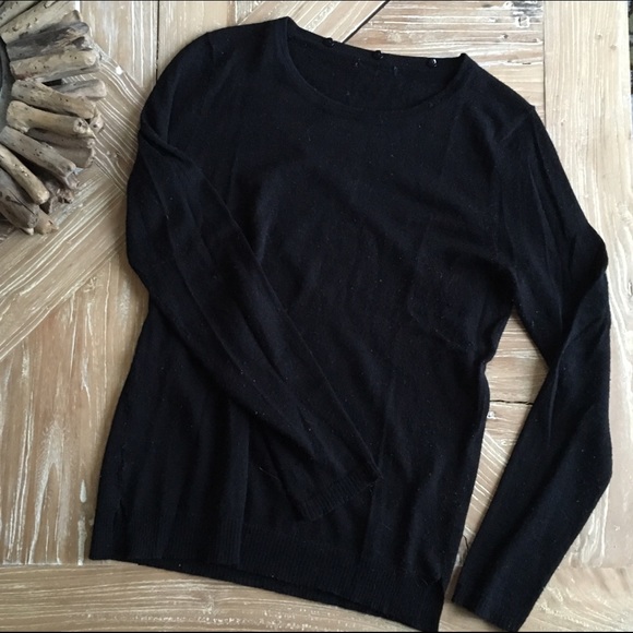 Sweater with detachable embellished collar.