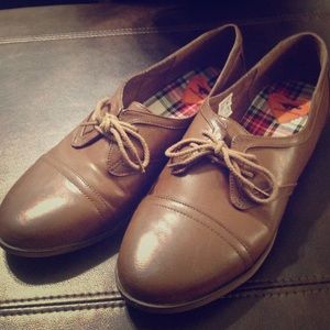 BRAND new brown leather shoes.