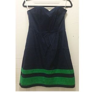 Strapless navy dress w/ green stripes at hem