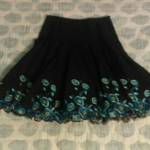 Black flounce skirt w exquisite blue flowers