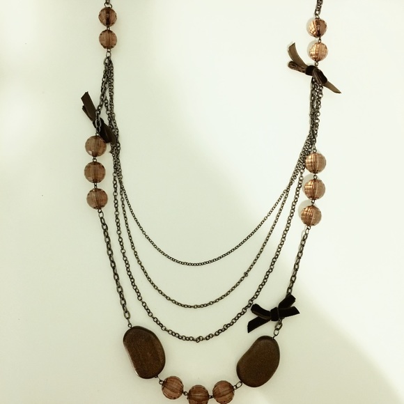 Long necklace with small ribbons and beads