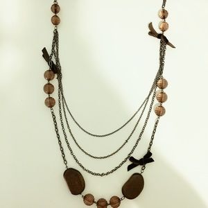 Long necklace with small ribbons and beads