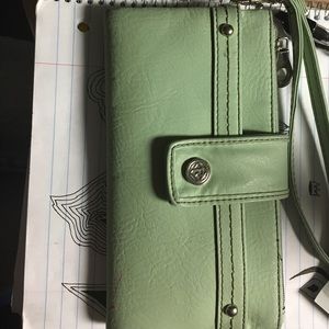 A mint green Relic wallet