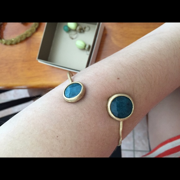 Gold arm band with blue stones