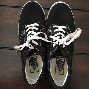 Worn black and white Vans
