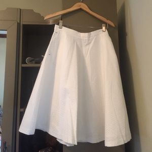 Knee length white Zara skirt.