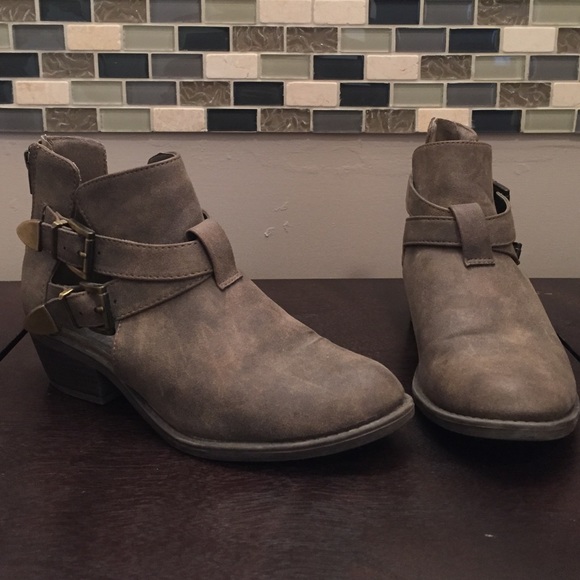 Short ankle booties with cut outs and small heel.