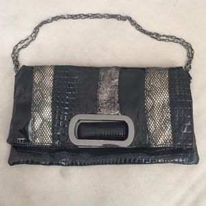 Sleek black, silver, metallic fold over clutch