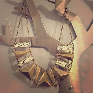 Necklace with gold and white snake print detail