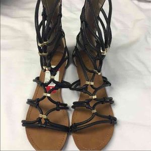 Black and gold gladiator sandal!