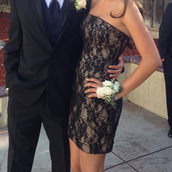 Short gold dress with black lace and black sequins